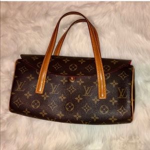 Louis Vuitton clutch.